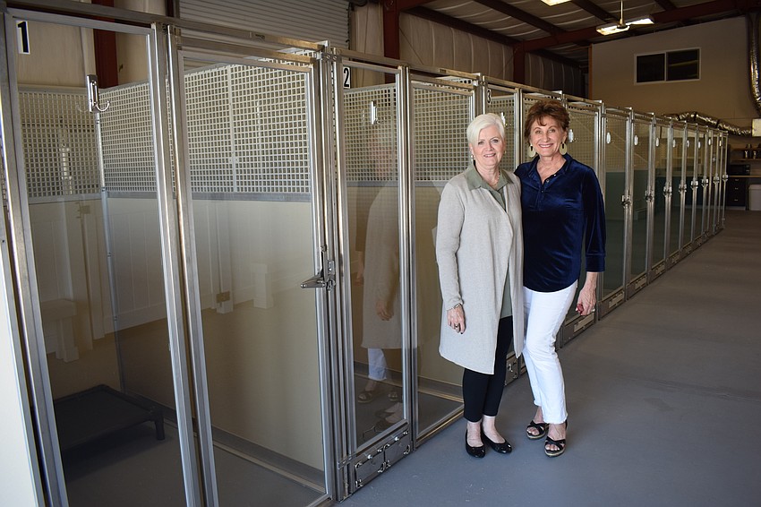 Deanna Murchie and Susan Giroux show the new dog kennels they have added to their site in Myakka City