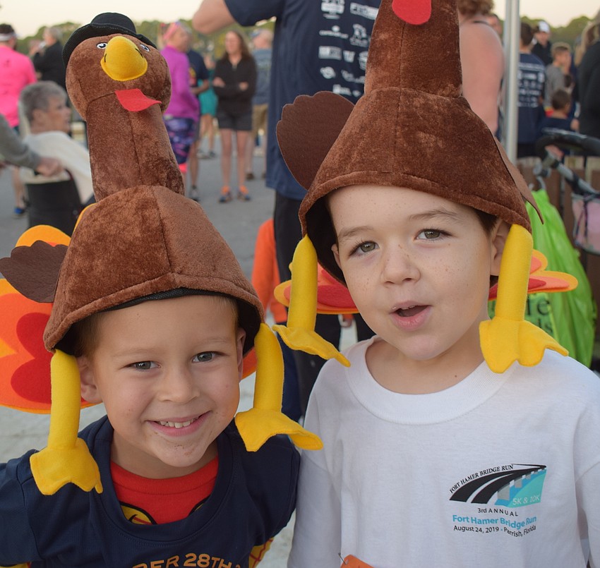 Palmetto's Noah Sterrett, 4, and Parrish's Jaxson Reid, 5, were showing off their turkey hats.