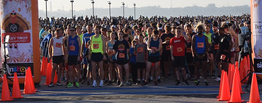 The 2,649 registered runners pack toward the start-finish line to begin the Florida Turkey Trot 5K.