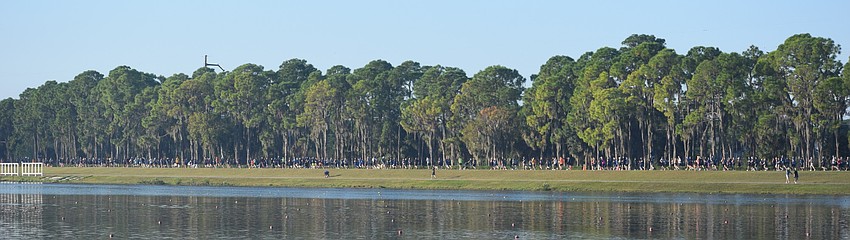Runners stretch along the lake at Nathan Benderson Park.