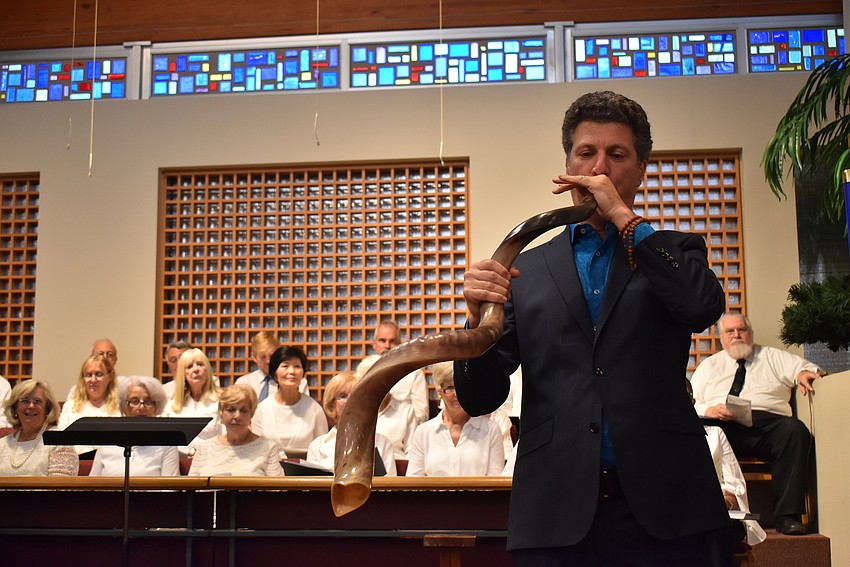 Lee Mirman blows the shofar.