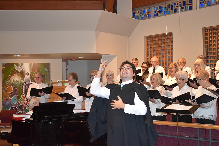 Michael Bodnyk from St. Armands Key Lutheran Church leads the choir.