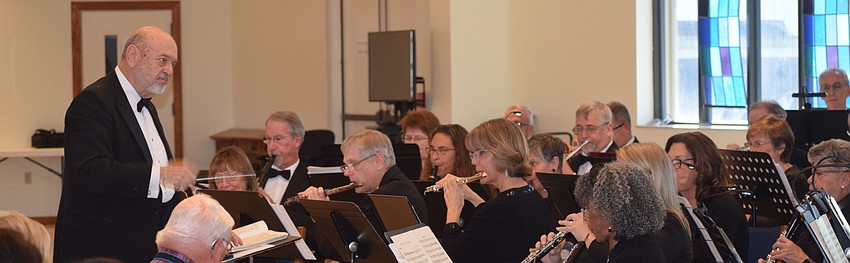 Joe Miller founded the Lakewood Ranch Wind Ensemble and he conducts the group during its first concert at Our Lady of the Angels Catholic Church.