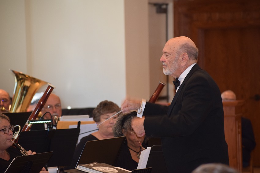 Joe Miller founded the Lakewood Ranch Wind Ensemble and he conducts the group during its first concert at Our Lady of the Angels Catholic Church.
