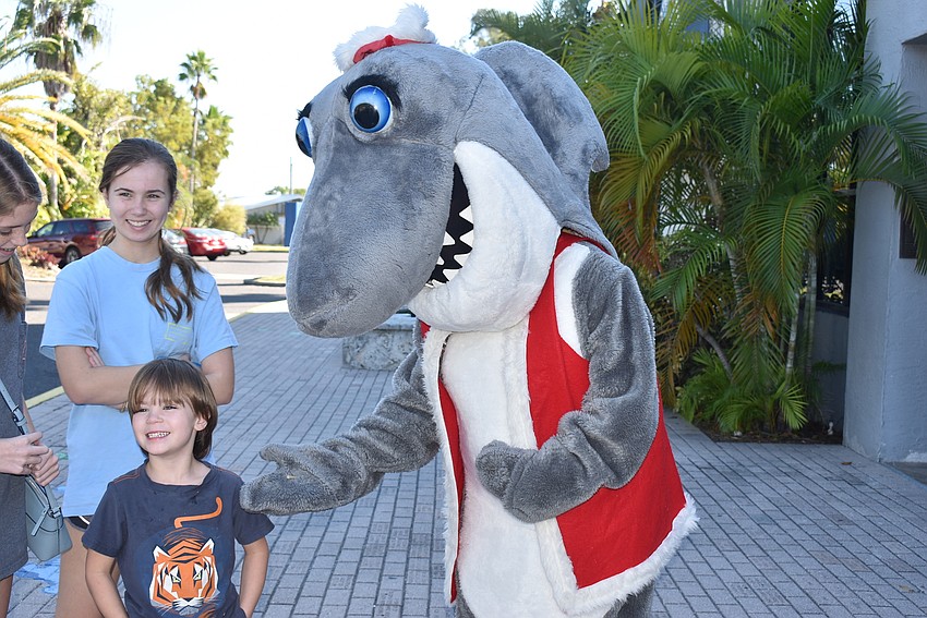 Ethan Cherry handed Santa Jaws his shark teeth he'd found.