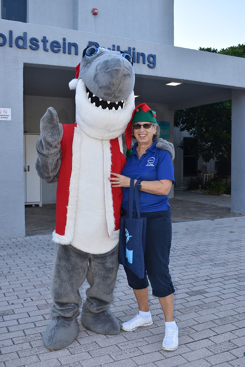 Santa Jaws photographer Sharon Dickman with the mascot.