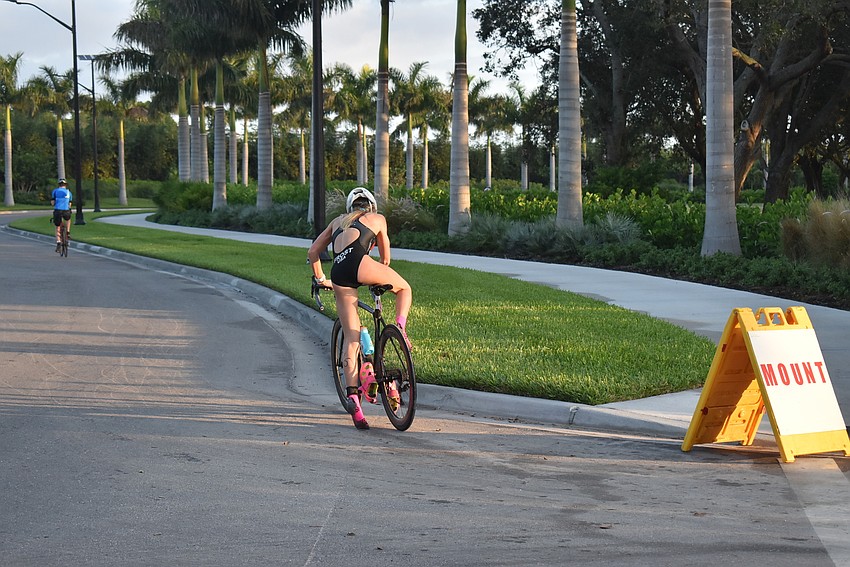 Hope Frost mounts her bike.