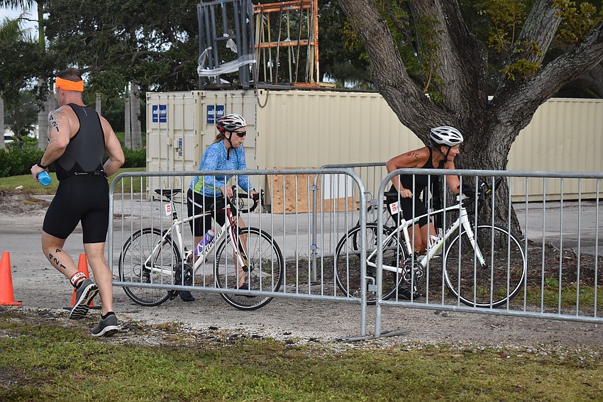 Cyclists head in while a runner heads out.