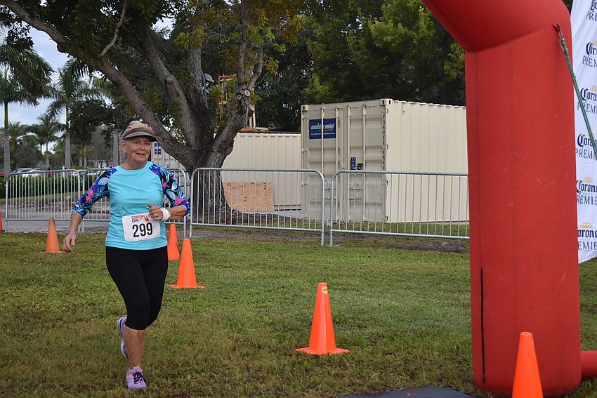 Kathleen Kleiber finishes the 5K.