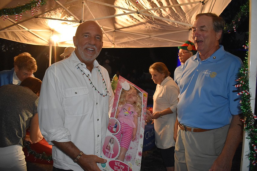 Richard Perlman drops off a gift at the Rotary Club of Longboat Key.