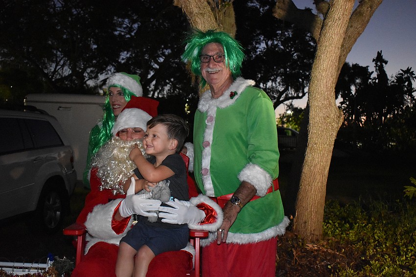 Alexandre Kirkland with Santa and the elves.