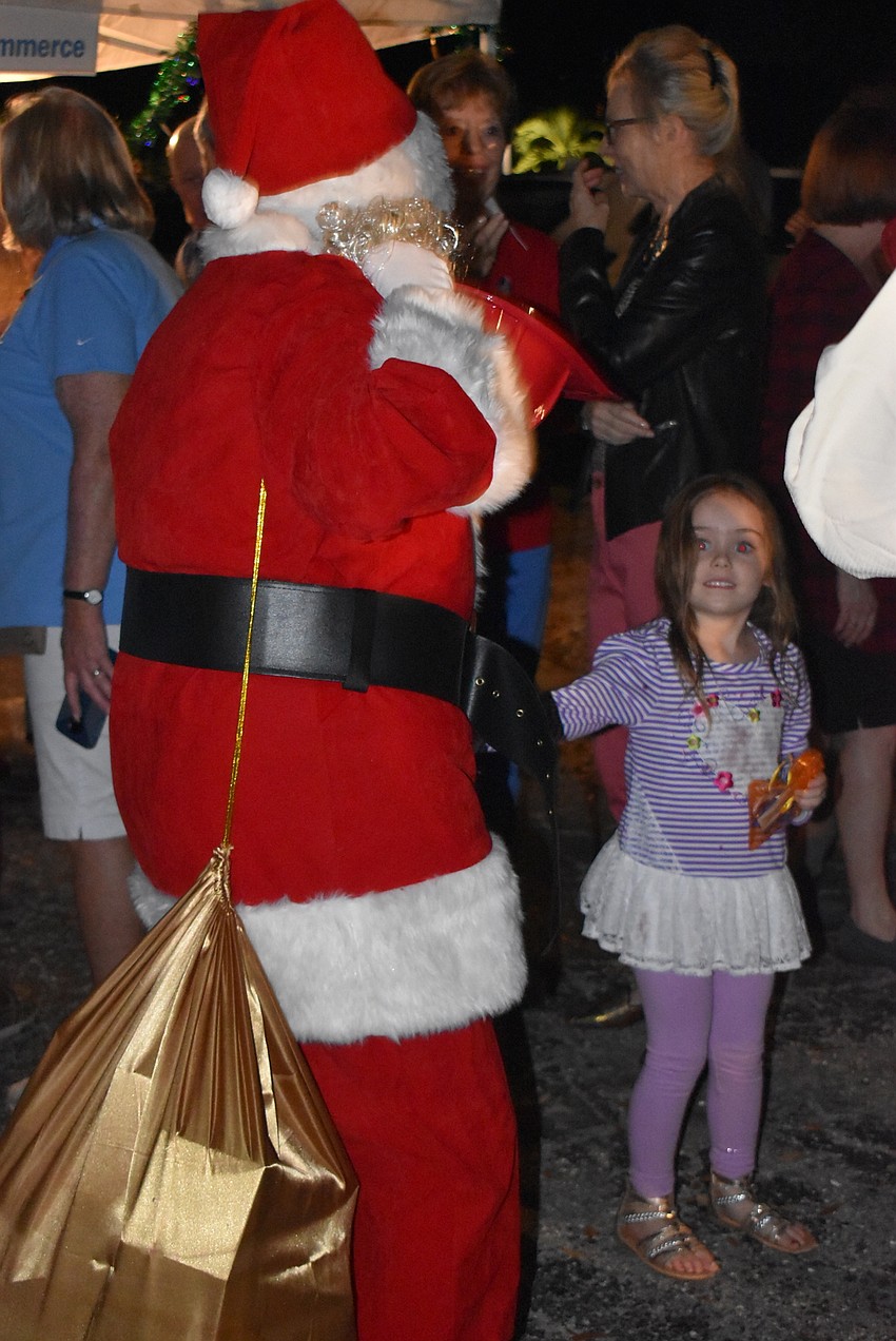 Santa dances with Emelia Herdliska.