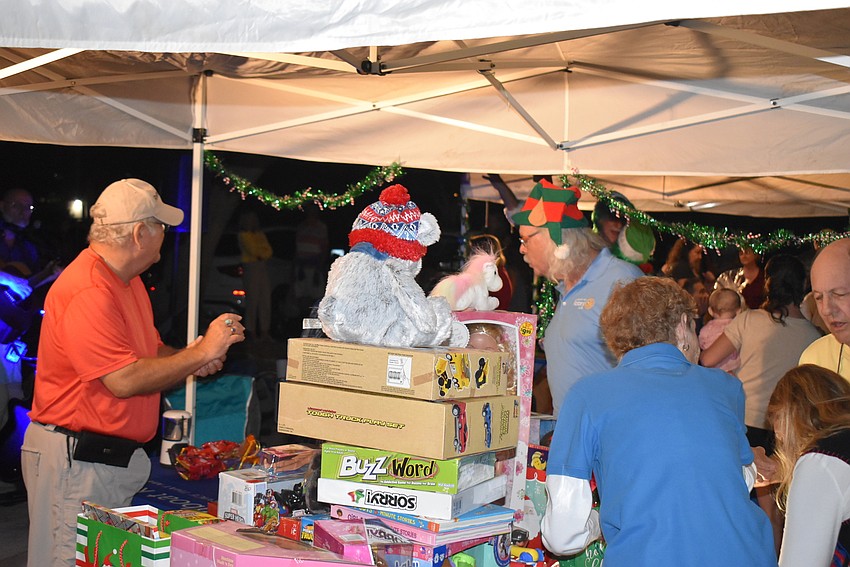 The pile of presents builds for the Rotary Club of Longboat Key.