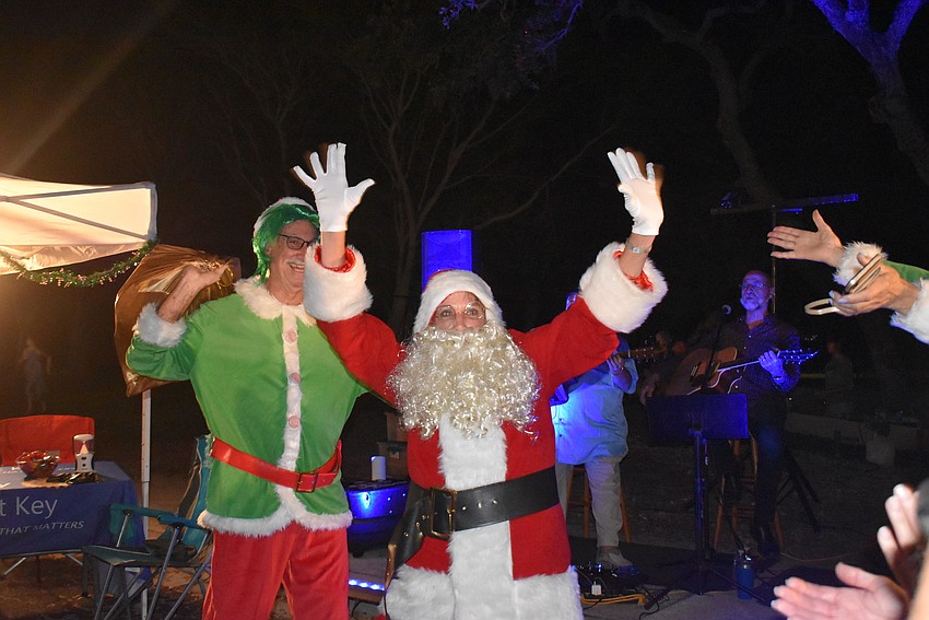 Santa delights the crowd with a dance.