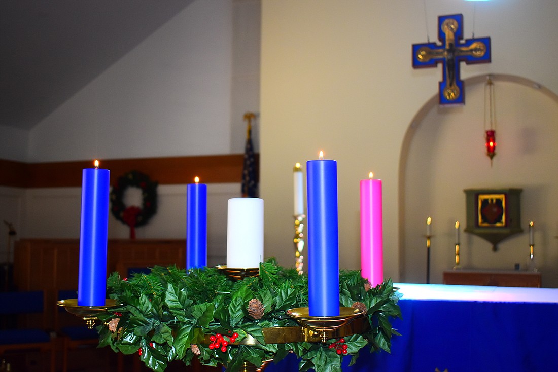 Part of the service involves lighting individual candles for personal concerns as well as four Advent candles with different names and meanings.