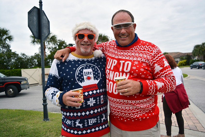 Friends John Downs and Dick Heidrick sported their best ugly Christmas sweaters. 