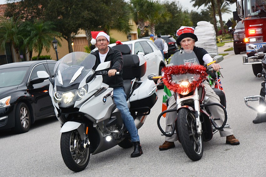 Paul Eisenberg and ARm Hedgecock help lead out the parade on their motorcycles.
