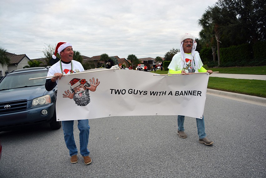 It wasn't their idea, but Bruce Perreault and Bob Gruber had fun with their role in the parade as 