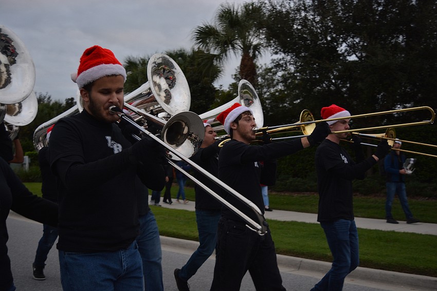 Lakewood Ranch High School's Brandon Cox joins the Mustangs' marching band to provide a real parade feel.