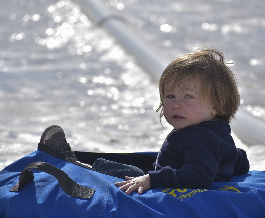 Grant Stickley, 2, slides down the ice hill.