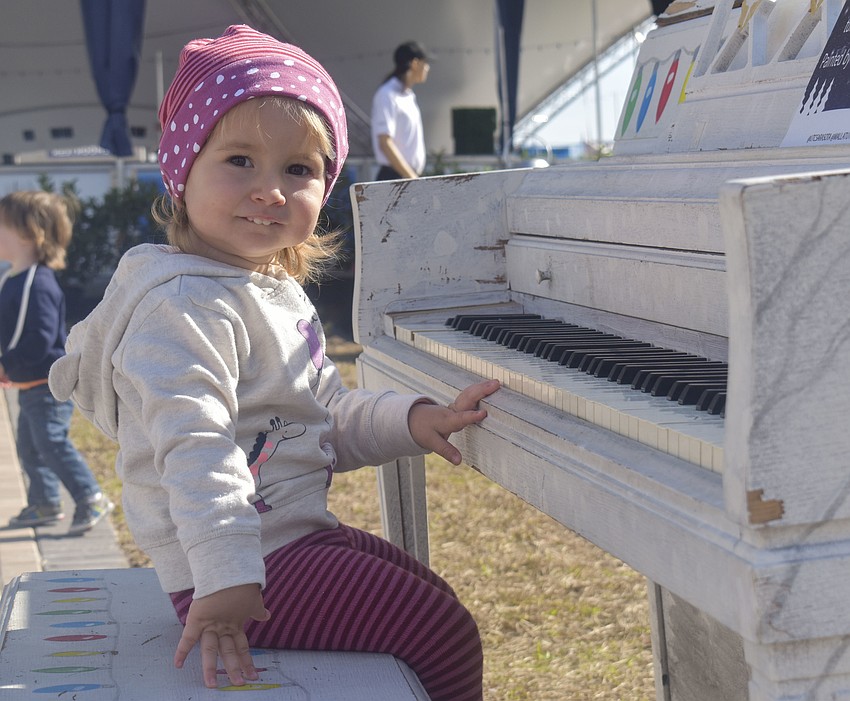 Nika Welihozkiy, 1, plays the piano .