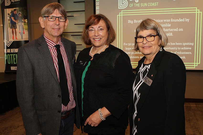 Tom Wood, president and CEO Joy Mahler and Susan Wood