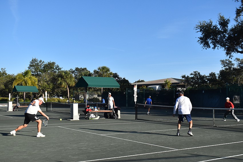 Doubles players vie for the win on Dec. 4.