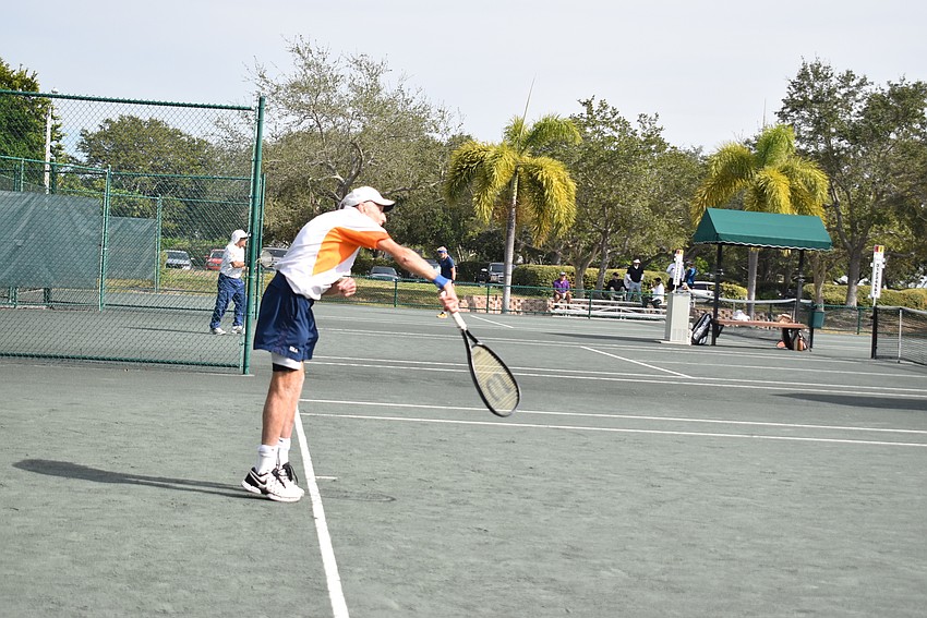 George McCabe serves in a singles match.