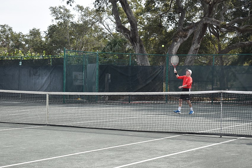 King Van Nostrand returns a serve.