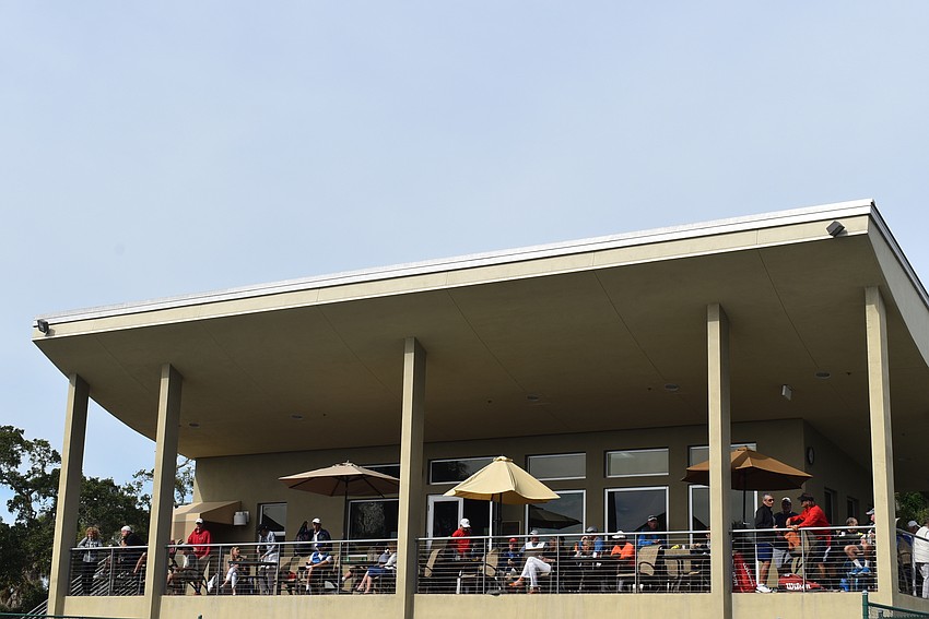 The upper deck of the Longboat Key Public Tennis Center was crowded with spectators and players-in-waiting.