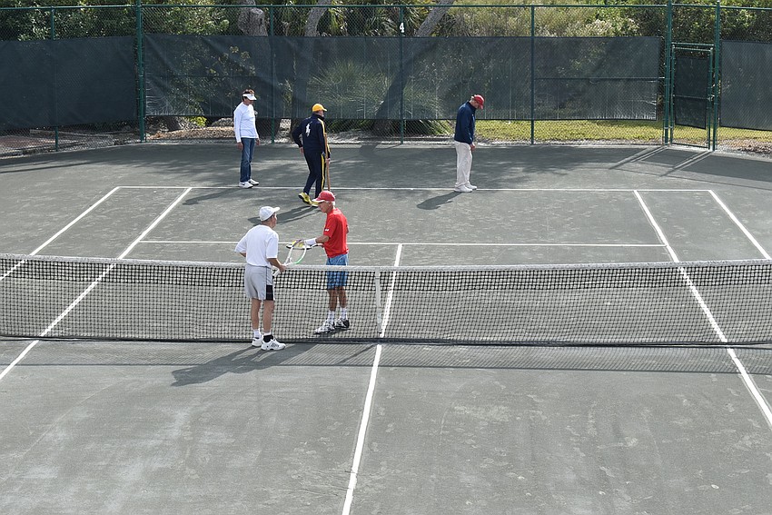 Stephen Sudarsky and Allen Carter greet each other before their match.
