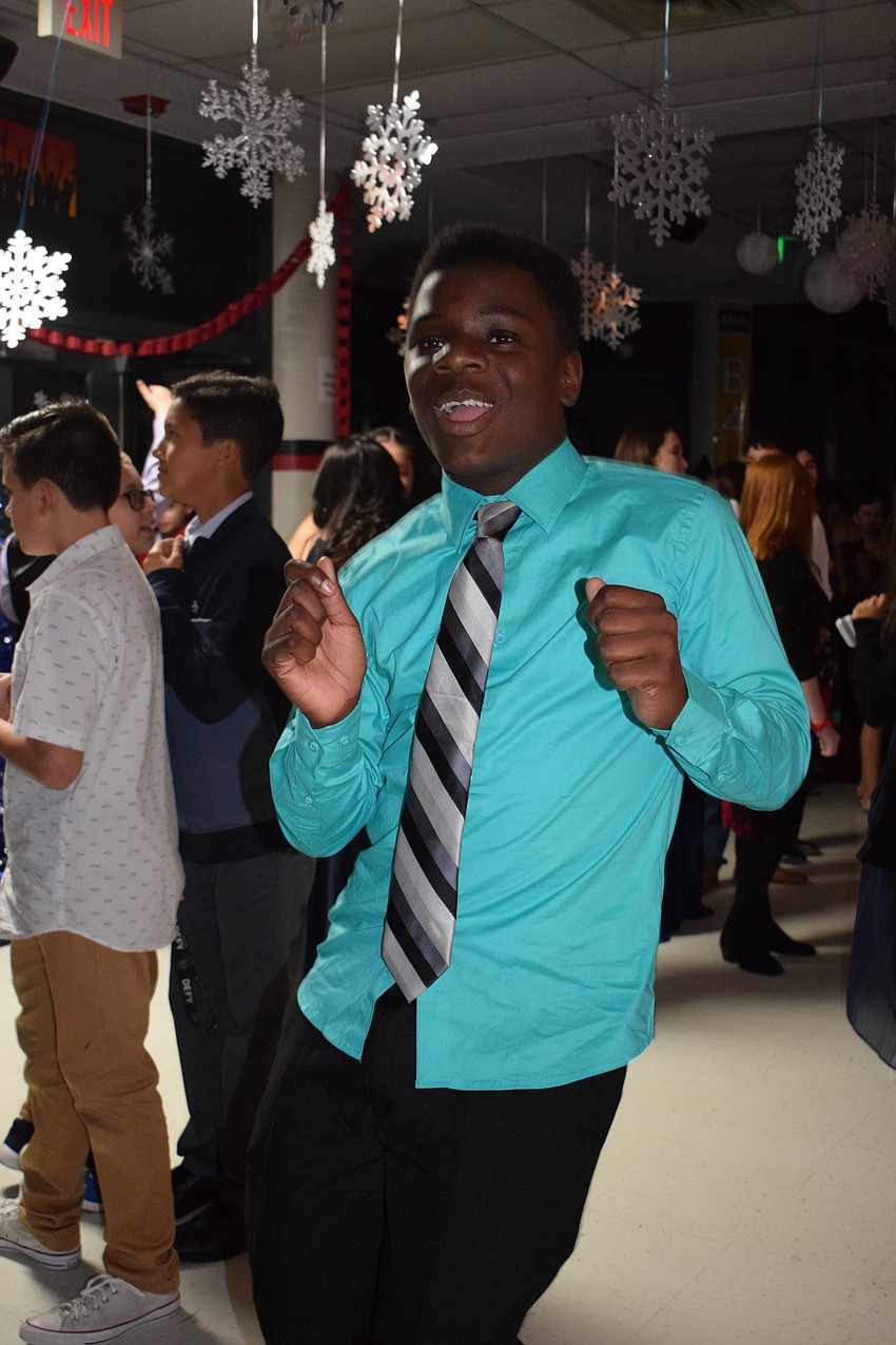 Trayvon Pinder, an eighth-grader, enjoys his first Snowcoming Dance. 