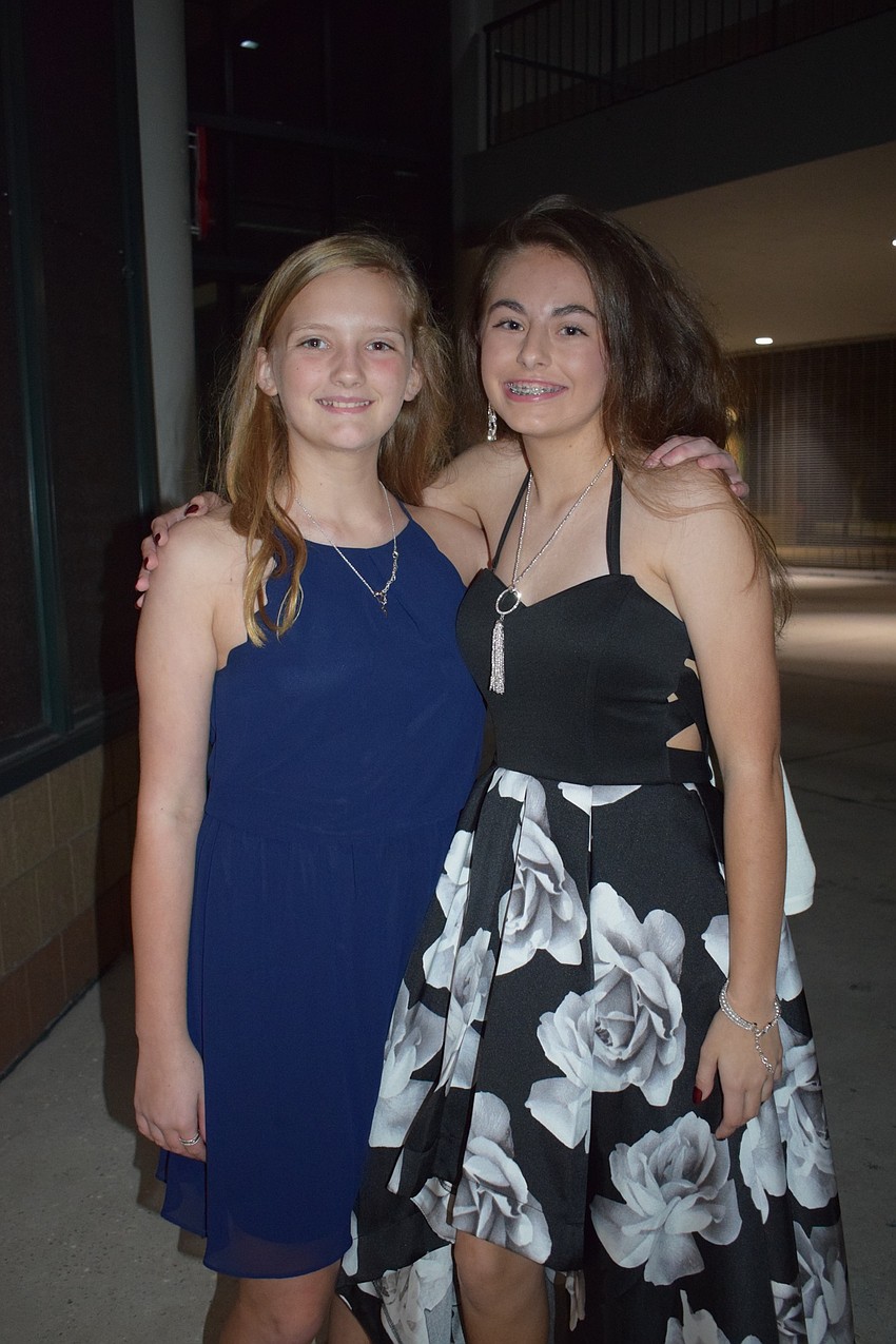 Lauren Wade and Haylee Hogan, seventh-graders, say they had a great time at the Snowcoming Dance.