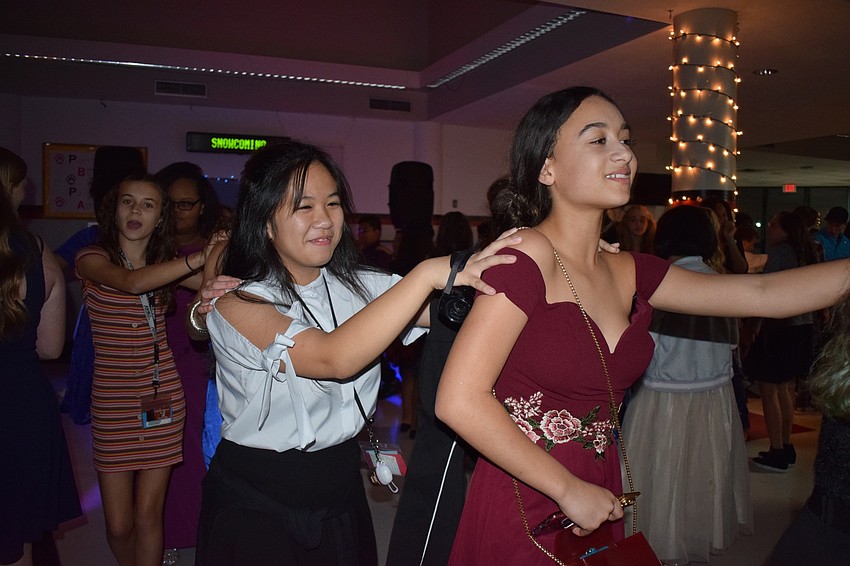 From back, Aryonna Morran, an eighth-grader, and seventh-graders Orchid Nguyen and Yaira Spears dance in a conga line.