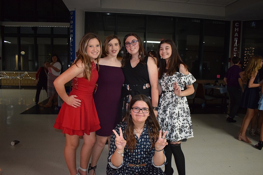 Jenna Davis, Ava Whidden, Shelby McGrew, Jenna Hamed and Caitlin Jordan, all eighth-graders, dance as a group.