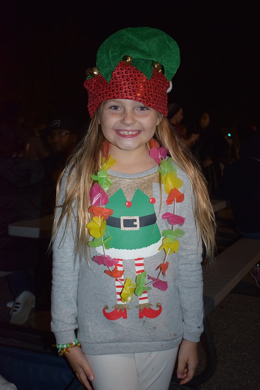 Summerfield resident Ali Upton, 8, dresses as an elf during Sledding with Santa. Upton was able to spend time with her grandparents, John and Elizabeth Curran, during the event.