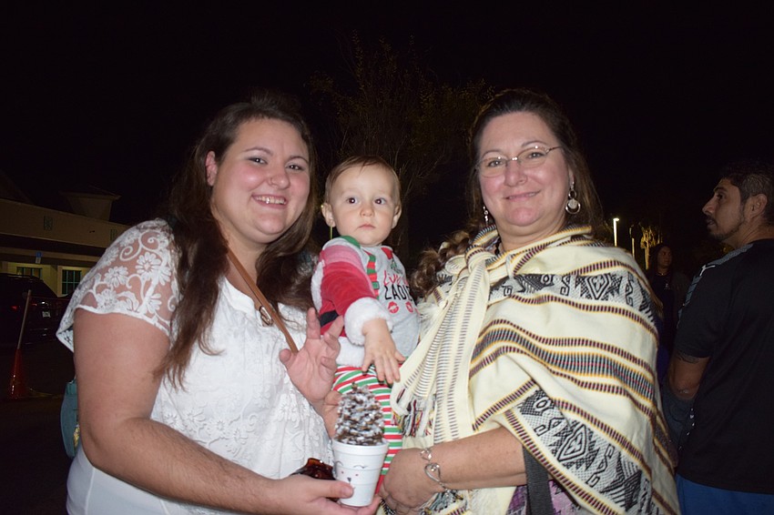 West Bradenton's Danielle, Lincoln and Melissa Steortz enjoy the festivities at Sledding with Santa. Lincoln Steortz turned 1 on Nov. 29.