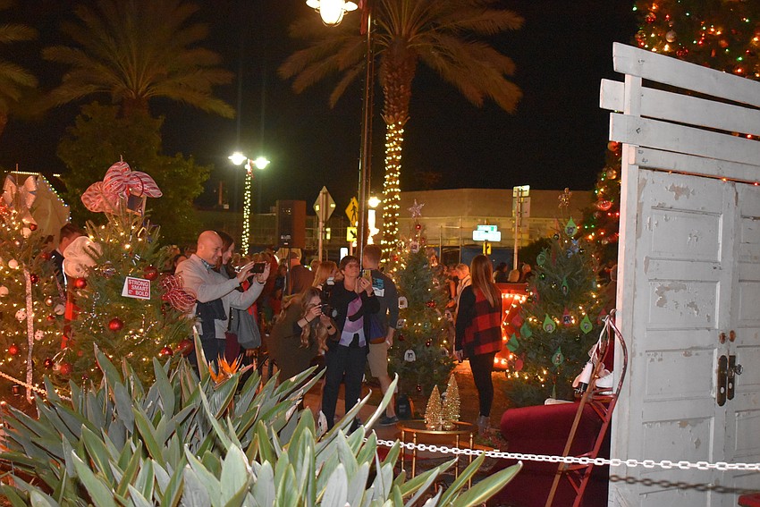 Photographers and parents lined up to get the perfect Santa shot.