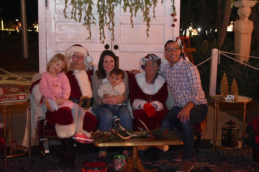Ivy, Christine, Noah and Evan Klumb with Santa and Mrs. Claus.