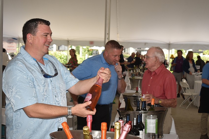 Paul Kauffman pours rose for guests.