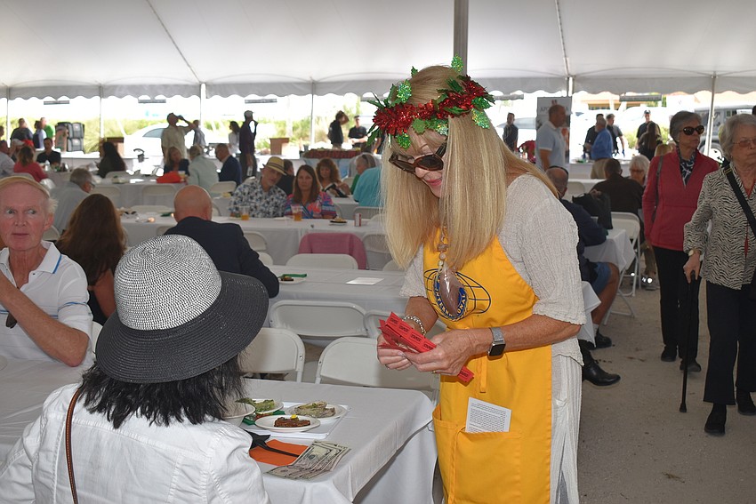 Gail Gilvey sells raffle tickets.