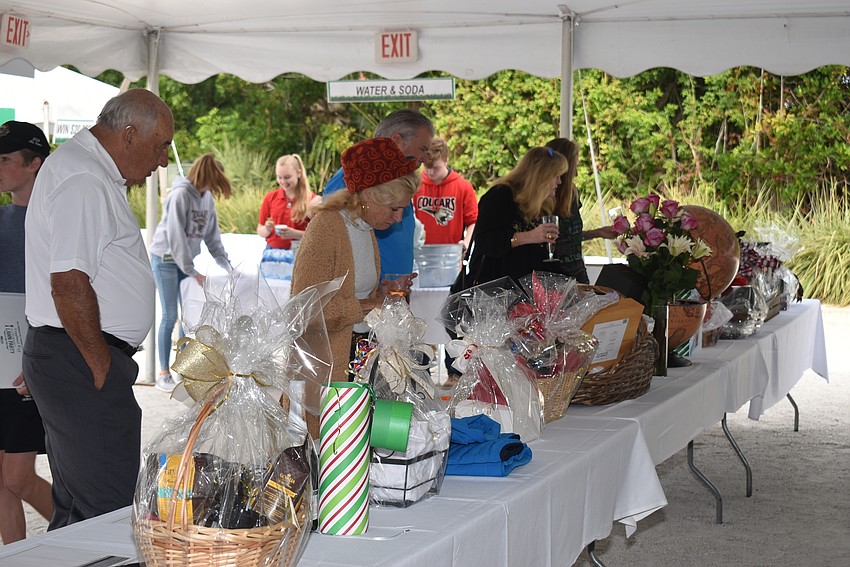 Guests browse the silent auction items.