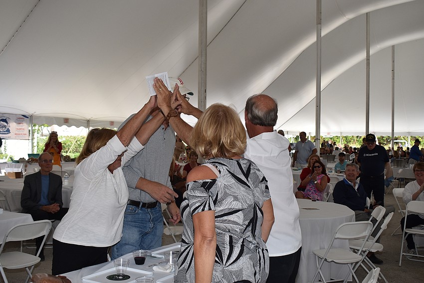 John and Karen Henry celebrate their win of the $20,000 raffle prize with Bill and Susanne Weber.