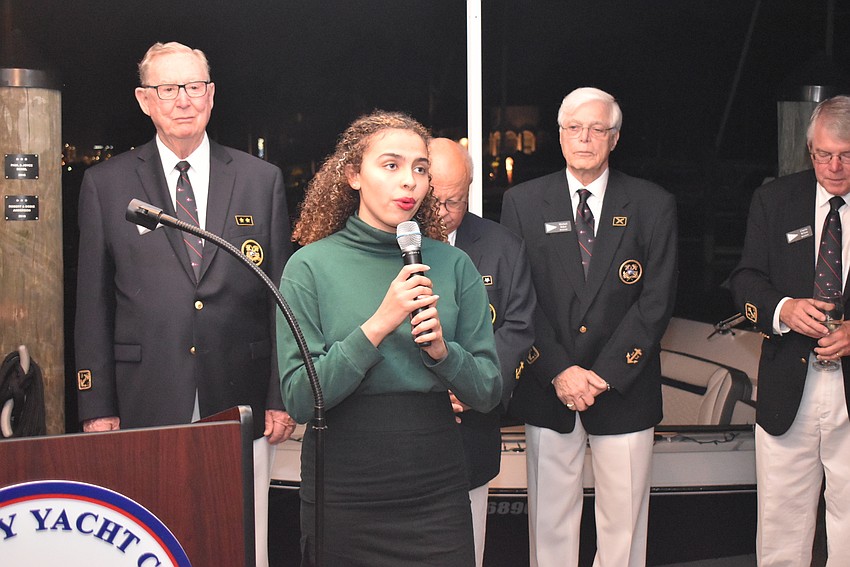 High schooler Keara Escobedo sings during the blessing ceremony.
