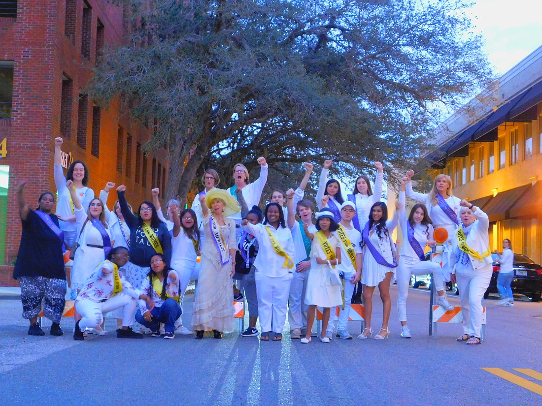 Women dressed as suffragists get into the spirit before marching in the Downtown Sarasota Holiday Parade, the first event on the Suffragist Project calendar.