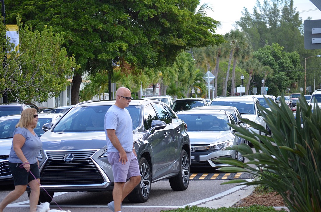 Traffic in St. Armands Circle often slows for pedestrians in crosswalks. (eric)
