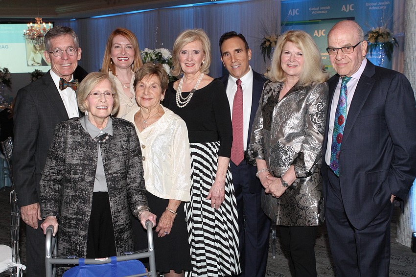 Co-chairs Matt Walsh, Lisa Walsh, Emily Walsh, Marilyn Shuman, Regional President Anne Virag, Regional Director Brian Lipton, and co-chairs Jo and Stan Rutstein