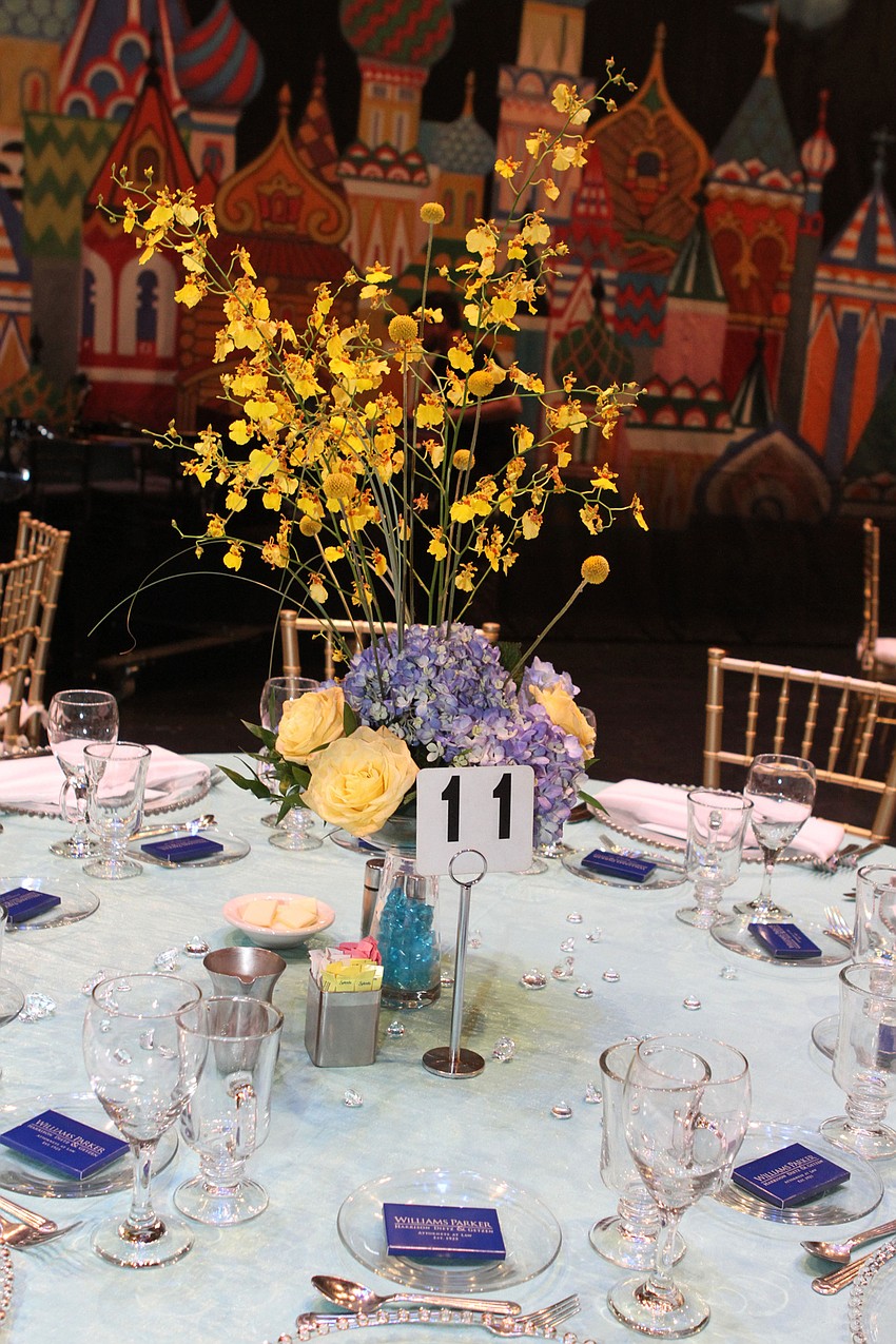 Each table has bright floral decor.