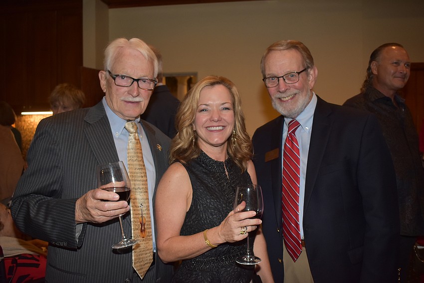 John Cavanaugh, Caryn Patterson and board member David Schenck.