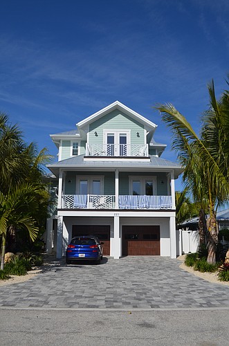 A listing for this Lido Key property advertises that the home has seven bedrooms and "sleeps 25."
